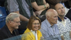 John Bertrand and his wife Rasa Bertrand, sitting next to billionaire Paul Little.