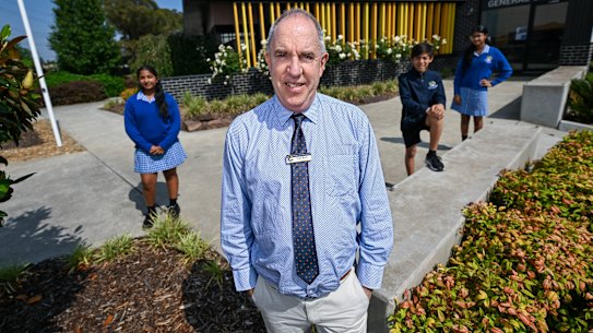 Wellington Secondary College principal Hugh Blaikie with year 7 students (left to right) Saanvi Vijay, Jordan Masip and Lisara Hewage.