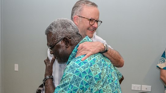 Solomon Islands Prime Minister Manasseh Sogavare greets Anthony Albanese at the Pacific Islands Forum in Fiji.