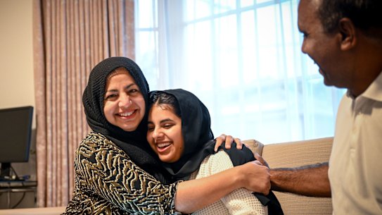 Hamna Sajid getting her ATAR result online with her parents Masooma Naseer Cheema, left, and Sagid Randhawa. 
