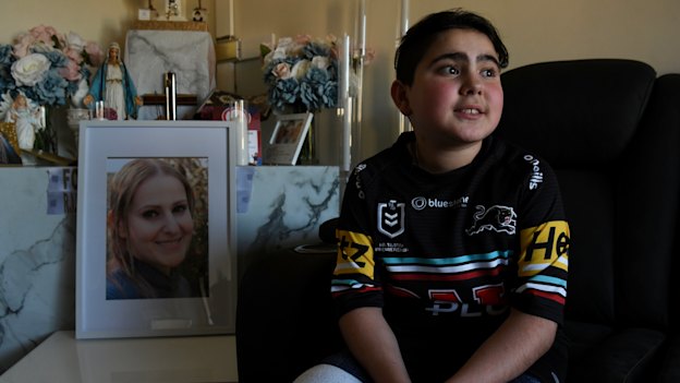 Nicholas Tadros sits by a portrait of his late mother, Vanessa, at the family’s Glenmore Park home.