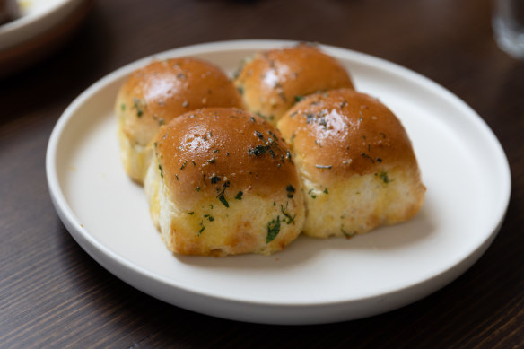 Pampushka, fluffy pull-apart dinner rolls glazed with garlic butter.