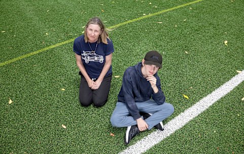 Cat Carver from Natural Turf Alliance, pictured with her son Max, is against the use of synthetic turf in schools. 