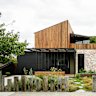 Emmaline Bowman made this Northcote garden feel welcoming by using widely spaced sleepers for a fence