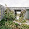 A climber-covered trellis screens Hedge House itself from its garden
