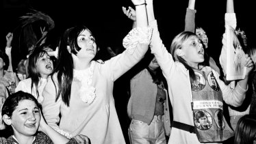 Fans cheer as the Monkees perform at Sydney Stadium on September 21, 1968.