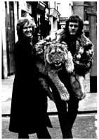 Anthony Bourke and John Rendall, right, with their cub raised in the wilds of Chelsea in London, first set paw on African soil with the help of George Adamson, 1989.