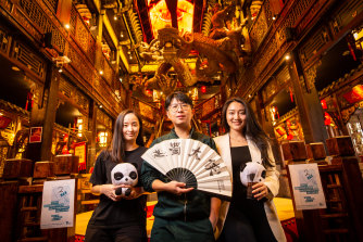 Panda Hot Pot general manager Evan Long (centre) will be serving guests from 11.59pm Thursday.