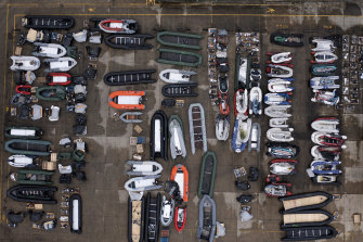 Inflatable boats, used by migrants to cross the English Channel, are stored at a facility in Dover, England, On Friday.