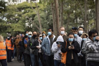 Hundreds of people wait to receive their COVID-19 vaccination at Homebush on Saturday.