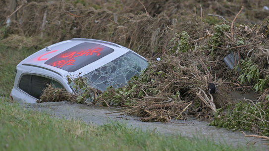 A car is washed into a ditch in Dartmoore Road west of Napier on February 16, 2023 in Napier, New Zealand. Cyclone Gabrielle has caused widespread destruction across New Zealand’s North Island with towns cut off and thousands without power.  (Photo by Kerry Marshall/Getty Images)