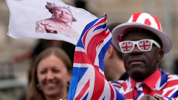 Royal fans greet the Queen as she arrived for the memorial service.