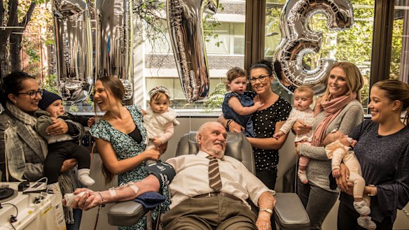 James Harrison, surrounded by mothers of Anti-D babies at his final donation. 
(from left to right): Christine Damiandis and Georgio, Michelle Dibbs and Eloise, Tanya McLaren and Brianna, Sarah Doyle and Grace.