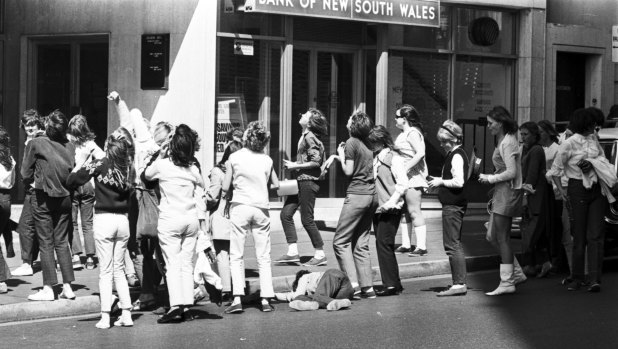 Fans of the Monkees wait outside the Sheraton Hotel in Kings Cross, Sydney, where the band was staying. One fan fainted from excitement, September 20, 1968.