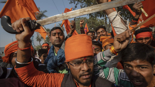 Hindu hardliners chant slogans against Muslim communities during a rally last November demanding a Hindu temple be built on the site of a 16th century mosque, destroyed in 1992.