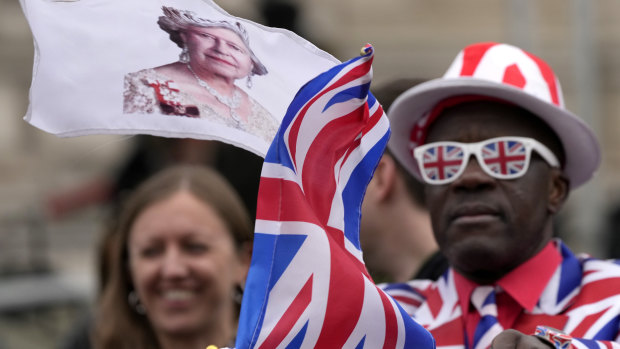 Royal fans greet the Queen as she arrived for the memorial service.