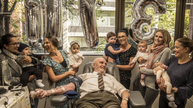 James Harrison, surrounded by mothers of Anti-D babies at his final donation. 
(from left to right): Christine Damiandis and Georgio, Michelle Dibbs and Eloise, Tanya McLaren and Brianna, Sarah Doyle and Grace.
