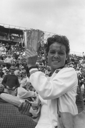 "Evonne Goolagong and the trophy she won as NSW champion."
