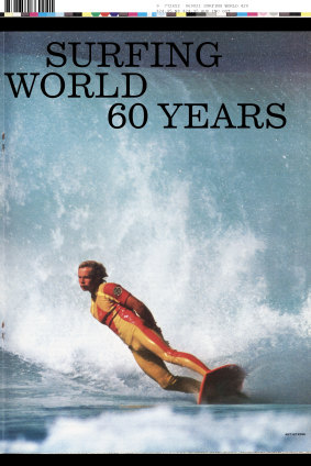 Ant Corrigan in his custom red and yellow, short-sleeved Rip Curl wetsuit and matching board on the cover of Surfing World’s 60th anniversary issue.