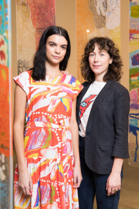Designer Lisa Gorman with model Domanique Hutchins wearing a dress with artwork from Mangkaja Artists.