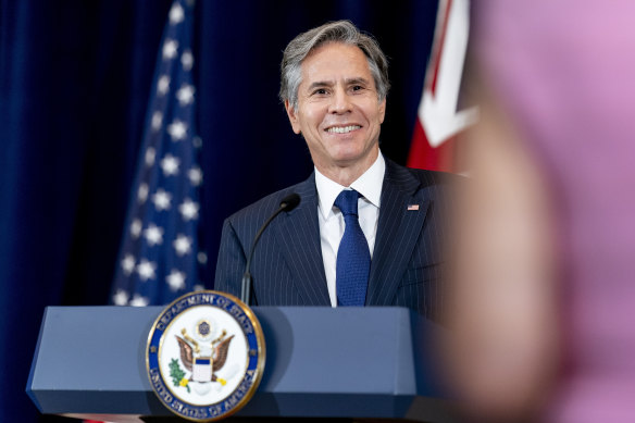 Secretary of State Antony Blinken smiles during a news conference with Minister of Defence Peter Dutton.