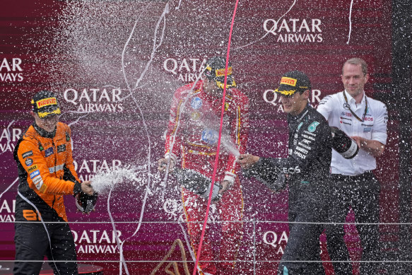 Oscar Piastri, George Russell and Carlos Sainz on the podium.