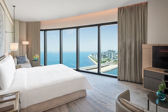 A sea-view room looks over Bluewaters Island, Ain Dubai, Jumeirah Beach and Palm Jumeirah. 