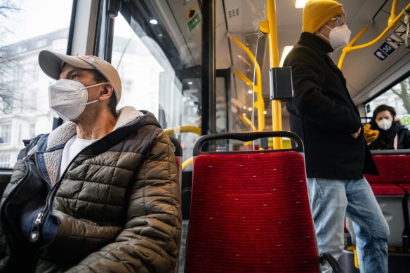 Passengers wear protective masks while travelling on a bus in Hamburg, Germany, on March 15.