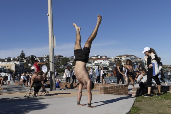 Revellers at Bondi Beach on Saturday, as Sydney recorded 35 new local cases.
