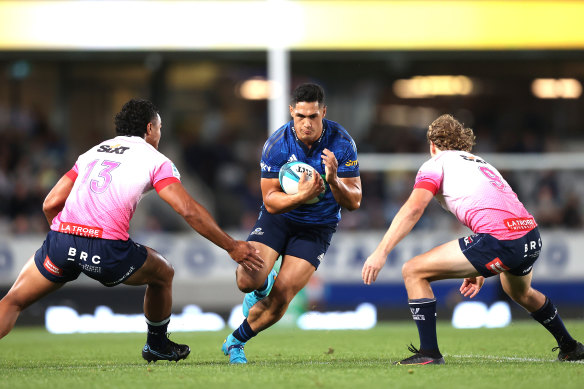 Roger Tuivasa-Sheck- of the Blues is tackled during the round 12 Super Rugby Pacific match between the Blues and the Melbourne Rebels.