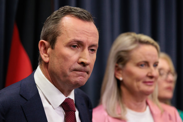 Mark McGowan was flanked by his wife, Sarah, and most of the state’s cabinet at his press conference on Monday.