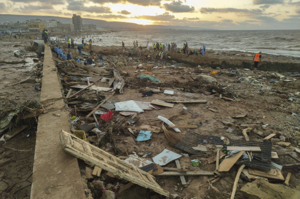 Rescuers and relatives search for bodies after flooding ripped through the city of Derna in Libya.