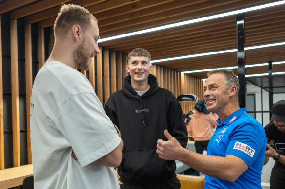 Clarkson chats with Ben McKay and Callum Coleman-Jones on the day he was announced as North Melbourne’s new coach