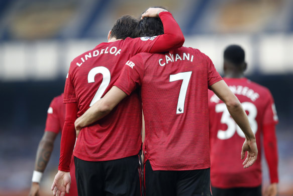 Edinson Cavani and Victor Lindelof celebrate Cavani's first goal for United.