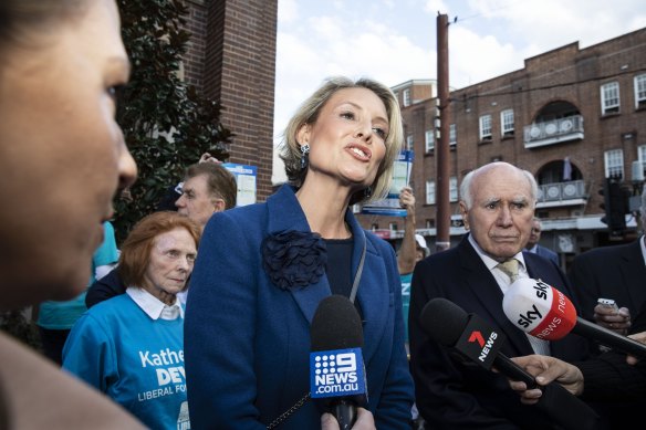 Warringah Liberal candidate Katherine Deves and former prime minister John Howard in Manly on Wednesday. 