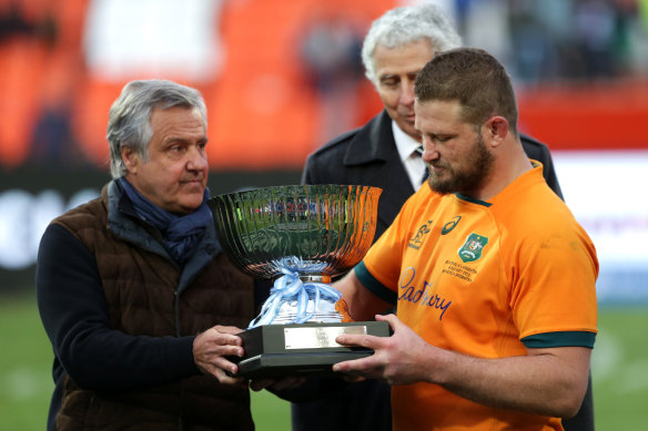 Australia’s captain, James Slipper, takes receipt of the Puma trophy after Australia’s win in Mendoza.