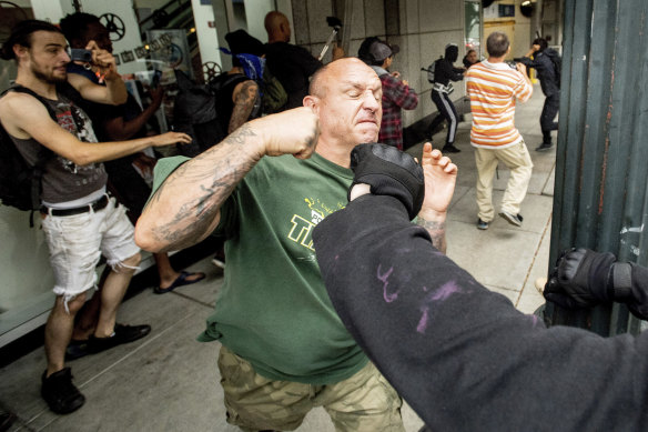 A man tussles with protesters against right-wing demonstrators in Portland on Saturday.
