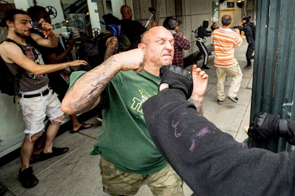 A man tussles with protesters against right-wing demonstrators in Portland on Saturday.