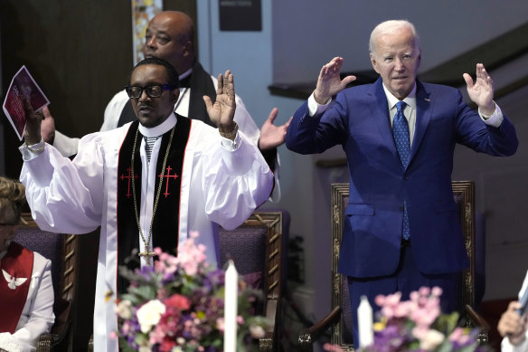 Joe Biden and Pastor Louis Felton pray at a church service at Mt Airy Church of God in Christ in Philadelphia, Pennsylvania.