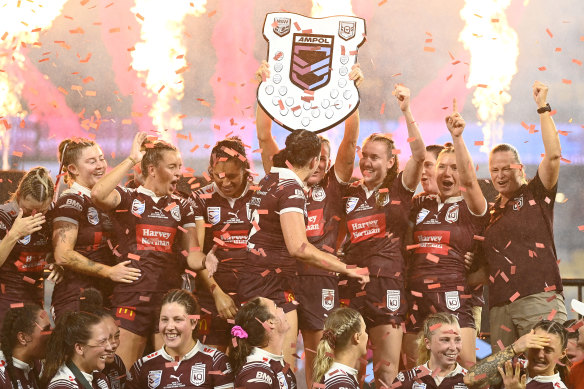 The Maroons celebrate their series win.