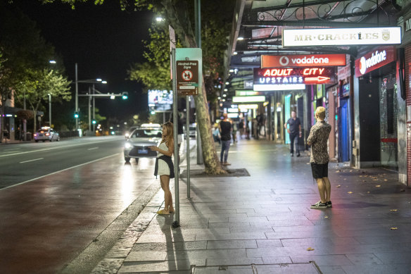 Punters spill out down an empty Oxford Street.