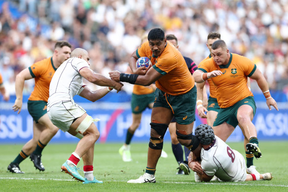 Captain Will Skelton is tackled by Beka Gorgadze of Georgia during the Wallabies’ opening World Cup game.