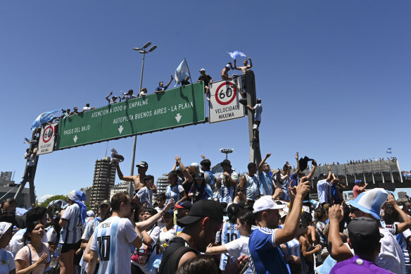 Fans climbed high to get a good view of their heroes.