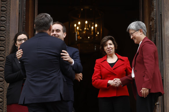 French Foreign Minister Catherine Colonna, second right, and French Defence Minister Sebastien Lecornu, second left, welcome Australian Defence Minister Richard Marles and Foreign Affairs Minister Penny Wong.