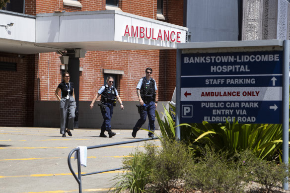 Police depart Bankstown-Lidcombe Hospital on Wednesday.