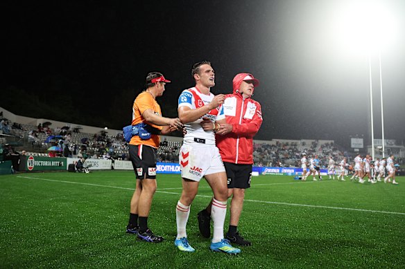 Hayden Buchanan leaves the field injured early in the match.