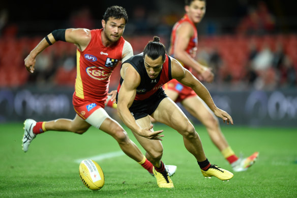Dylan Shiel leads Jarrod Harbrow to the ball.