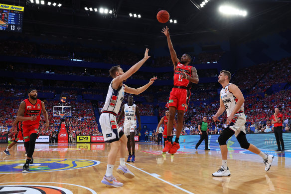 Bryce Cotton of the Wildcats puts a shot up.
