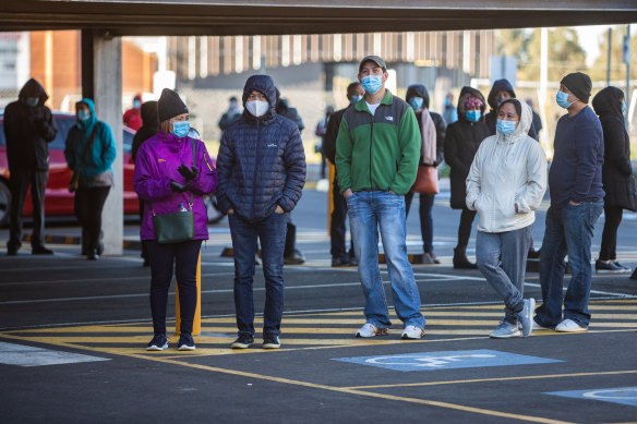 People wait in line to get a COVID-19 vaccine in Melbourne last week.