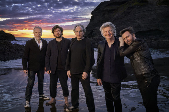 The new Crowded House line up on a New Zealand beach in March. From left, Nick Seymour, Elroy Finn, Mitchell Froom, Neil Finn, Liam Finn.